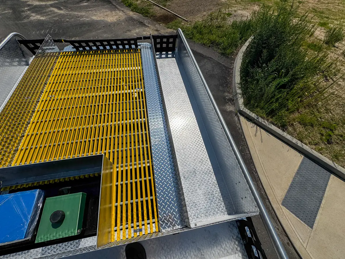 Top deck view showing center hatch area and grating near rear edge.